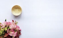 A Bouquet Of Pink Roses And Alstroemeria And A Jar With A Greasy Cream For The Face, Body. Cosmetic Product. View From Above.