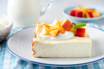 Wall Mural - Cottage cheese casserole served with fruits and sour cream. Sweet breakfast cheese pudding