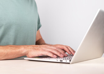 Poster - Hands closeup, typing, writing letter on laptop computer keyboard. Arms at PC on desk closeup