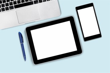 Poster - Tablet and smartphone with blank screen on desk. Business