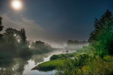 Wall Mural - landscape with moon light at night over river. fog above water and trees