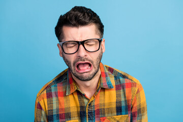 Photo of yell brunet guy crying wear eyewear yellow shirt isolated on blue color background