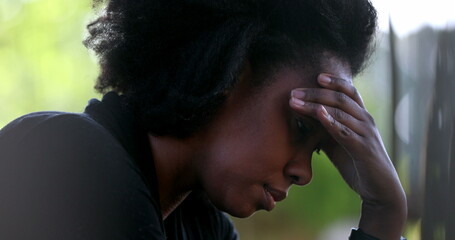 Wall Mural - Preoccupied black woman feeling stress and pressure. African person suffering