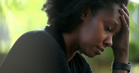 Wall Mural - Preoccupied black woman feeling stress and pressure. African person suffering