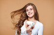 woman with strong healthy hair using hair dryer