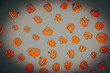 Halloween carved in wood Pumpkins pattern on colored background.