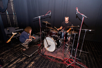 Wall Mural - Rock band recording their music in the professional recording studio