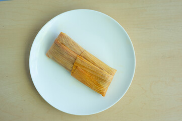 Poster - Single tamale on a white plate