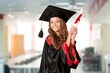 Pretty woman with graduate bechalor degree. Education successful university college woman smiling achievement Academic graduate.