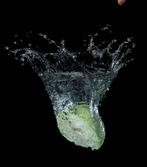 Wall Mural - head of lettuce with water splash isolated on black background,lettuce washing