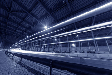 Poster - light trails and head lights of traffic in tunnel. Transportation background