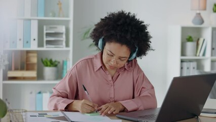 Wall Mural - Business woman and writing notes from laptop with music streaming app with headphones to relax. Startup worker with focus, concentration and determination for project planning in office.