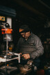 © Scopio - Older man working in his workshop