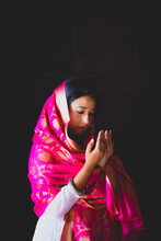 Portrait Of Indian Woman Wearing Saree Praying