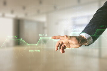 Poster - Man hand working with abstract virtual stats data hologram on blurred office background. Multiexposure