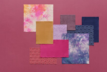 Horizontal From Above Flat Lay Composition Of Colorful Pieces Of Fabric On Dark Purple Surface