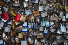 Old And New Padlocks With Names And Dates Written On Them Lock On A Bridge As A Sign Of Love In San Antonio, Texas.
