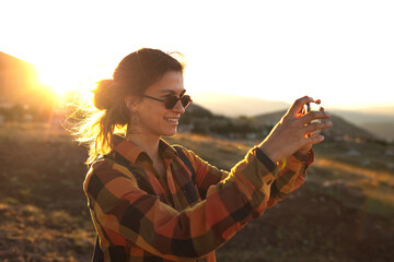 Wall Mural - girl taking pictures on the phone