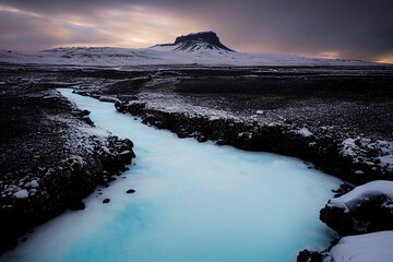 Poster - Breathtaking view of a frozen water stream with a view of a rocky mountain in the background