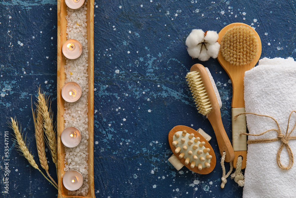 Composition with bath accessories and burning candles on color background