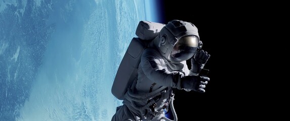 Wall Mural - female astronaut having a video call on her phone while performing space walk in open space, earth i