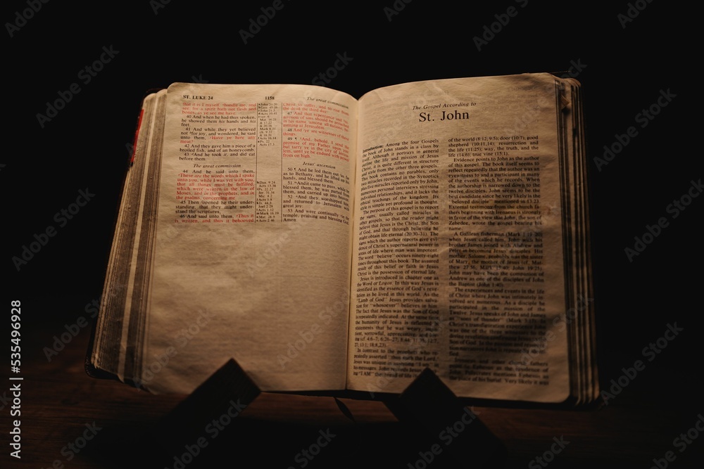 Closeup shot of a historic old Bible open on the St. John pages on ...