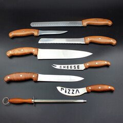 Wall Mural - A good set of kitchen knives for slicing. Set of steel kitchen knives