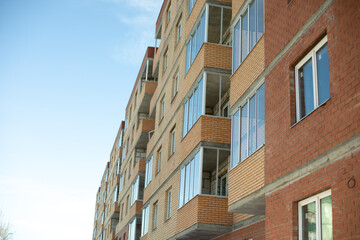 Wall Mural - Building is made of brick. New building in city. Wall of house. Brick wall.