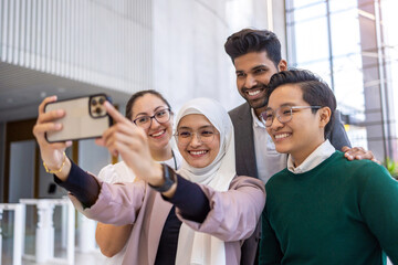 Poster - Multi-ethnic business group taking a self portrait in office
