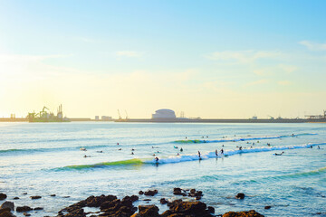 Surfers Matosinhos Leixoes Port sunset