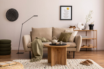 Domestic and cozy interior of living room with beige sofa, wooden shelf, green plaid, coffee table, decoration and boucle carpet. Mock up poster frame. Beige wall. Home decor. Template. 