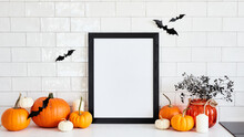 Black Picture Frame Mockup With Pumpkins, Halloween Home Decor, Vase Of Flowers On Table In Scandinavian Kitchen Interior. Happy Halloween Poster Design.
