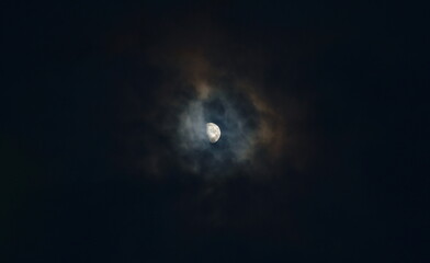 Wall Mural - half moon cover by spreading cloud in night