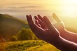 Christian person hands pray on nature background.