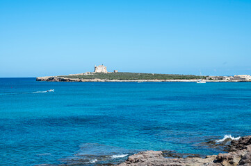 The island of Capo Passero in front of Portopalo where the waters of the two seas divide, the Ionian Sea and the Mediterranean Sea