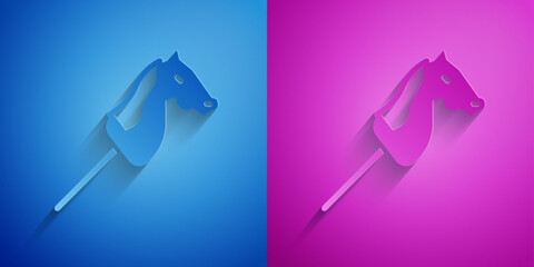 Wall Mural - Paper cut Toy horse icon isolated on blue and purple background. Paper art style. Vector