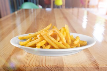 Wall Mural - Tasty fast food French fries in plate