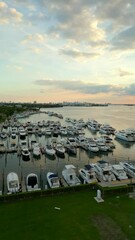 Wall Mural - Vertical aerial video Miami marina yachts at sunset 4k