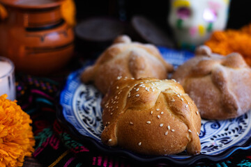 Mexican bread on Altar with sugar skull and hot chocolate traditional food for Celebration of Mexico's Day of the Dead