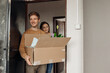 © Татьяна Волкова - Vertical smiling, curious, communicative students newbies taking carton boxes with things. College life, education start