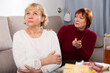Two offended elderly women squabbling at home