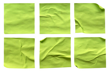 A set of blank fluorescent green rectangular paper glued crumpled and creased note memo isolated on white background.