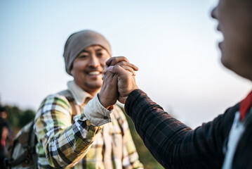 Close-up of Teamwork helping hand trust help