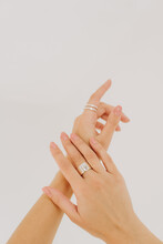 Hands Of Beautiful Woman Wearing Stylish Jewellery. Copy Space. Female Hands With Silver Ring. Trendy Accessories