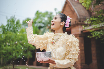 Portrait beautiful woman in Songkran festival with Thai Traditional costume