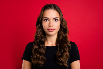 Wall Mural - Photo of adorable pretty young woman wear black t-shirt smiling isolated red color background