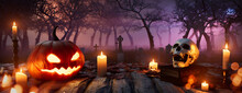 Halloween Banner With Candles, Skull And Jack-O-Lantern. Spooky Churchyard Tabletop.