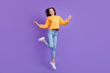 Sticker - Full body length photo of young attractive nice girl dancing celebrating trampoline jump hands up good mood isolated on purple color background