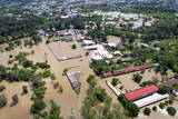 Fototapeta  - High-angle view of the Great Flood, Meng District, Thailand, on October 3, 2022, is a photograph from real flooding. With a slight color adjustment
