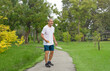 © Verin - happy senior man enjoy playing badminton in the park, asian sporty elderly male having fun outdoor activity